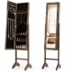 Freestanding jewelry armoire in brown with velvet lining and full-length mirror, ideal for jewelry and cosmetics.