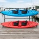 Freestanding kayak storage rack with two kayaks, featuring a durable metal frame and lockable wheels for easy.