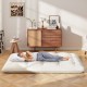 Beige full-size futon mattress sleeping pad with washable cover, shown on the floor with a person sleeping comfortably.