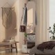 Full-length mirror coat rack in walnut with shelves and hooks, ideal for bedroom or entryway storage and organization.