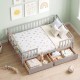 Full-size gray daybed with fence, two pull-out drawers, and safety guardrail for children's room organization.