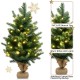 24-inch tabletop fir artificial Christmas tree with 35 warm white LED lights and burlap base for festive decor.