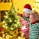 24-inch tabletop fir artificial Christmas tree with warm white LED lights, ideal for personalizing your holiday decor.