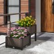 Elevated plastic raised garden bed planter kit in brown with vibrant flowers, perfect for outdoor gardening.