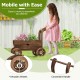 Decorative wooden wagon cart in rustic brown with wheels and handle, ideal for displaying potted plants in your garden.