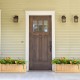 Folding wooden raised garden bed with removable bottom, ideal for growing herbs and flowers on patios or decks.