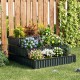 Three-tier heavy-duty metal raised garden bed planter box in black, ideal for various plants, placed against a wooden.