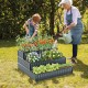 Three-tier black metal raised garden bed planter with vibrant plants, ideal for vegetables and flowers in various root.