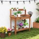 Outdoor wooden garden table work station featuring a top open shelf and slatted bottom shelf for efficient gardening.