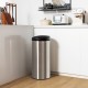 Stainless steel 8-gal automatic trash can with touchless lid, placed in a modern kitchen for convenient waste disposal.
