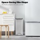 Slim stainless steel trash can with soft-closing lids, designed for easy access and space-saving in any corner.
