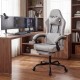 Height adjustable gray gaming chair with headrest and lumbar support, perfect for long hours of gaming or work.