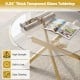 Round glass coffee table with 0.24" thick tempered glass top and geometric gold metal frame for modern aesthetics.