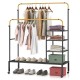 Rolling double rods garment rack in black and gold, featuring adjustable bars and shelves for versatile clothing.