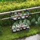 Two-tier flower pot holder with adjustable hooks, featuring elegant curved patterns, ideal for porch or patio use.