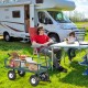 Heavy-duty garden utility cart with durable rubber wheels, ideal for transporting oversized loads in outdoor settings.