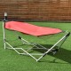 Red portable folding hammock with sturdy steel frame, ideal for camping, backyard relaxation, or indoor use.