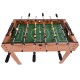 Indoor competition foosball table with wood construction, steel rods, and scoring device for family and friends' fun.