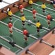Foosball table featuring 14 players, wood construction, and scoring devices, perfect for indoor games with family and.