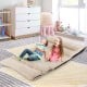 Adjustable floor sofa bed in beige with two lumbar pillows, perfect for kids' playtime and lounging.