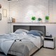 PU leather upholstered wall-mounted headboard with soft sponge, perfect for enhancing bedroom comfort and style.