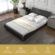 Full-size upholstered platform bed frame in faux leather with a curved headboard, designed for comfort and easy.