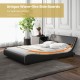 Upholstered platform bed frame with curved headboard in faux leather, designed for ergonomic support and comfort.