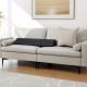 Trapezoidal bed wedge pillow in a light color, designed to fill gaps and support spinal alignment on sofas or beds.
