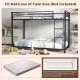 Twin over twin metal bunk bed in black with full-length guardrails and ladder, perfect for space-saving in youth dorms.