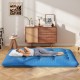 Blue foldable futon mattress with washable cover, shown in a living room setting, ideal for camping and home use.