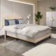 Beige heavy-duty upholstered bed frame with rivet headboard, featuring wood slats for stability and modern design.
