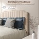 Beige upholstered headboard with rivets, designed for full-size bed frame, enhances comfort for reading and watching TV.