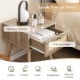 Modern rattan nightstand featuring a spacious tabletop and pull-out drawer, perfect for bedroom or living room storage.
