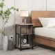 3-tier end table with USB ports and power outlets, featuring a metal frame, placed beside a bed for convenient charging.