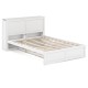 Twin/Full kids wooden platform bed with trundle storage and high headboard, featuring stable slats for support.