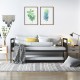 Twin metal daybed with trundle and lockable wheels, featuring a sleek industrial design for versatile room use.