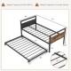 Twin metal daybed with trundle, featuring lockable wheels and sturdy slats, ideal for living room or guest room use.