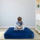Blue 57 x 57 inch crash pad sensory mat with soft foam blocks, ideal for reading, playing, and safe sensory stimulation.
