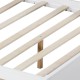 Wooden slats of a twin/full size daybed frame with solid wood legs, designed for stability and support without a box.