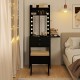 Compact vanity desk set in black with a lighted mirror, storage drawers, and a soft stool for makeup application.