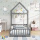 Twin size gray house floor bed with house-shaped headboard, low-to-ground design for easy access in a kid's room.