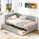 Twin size gray daybed with two storage drawers, perfect for extra sleeping space and organized storage in small areas.