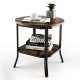 Round 2-tier side table with rustic brown MDF top and black steel frame, perfect for living room or bedroom use.