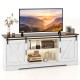 White TV stand with sliding doors, adjustable shelves, and LED lighting for 65-inch TVs, perfect for living room decor.
