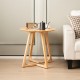 24-inch round end table made of rubber wood with V-shaped legs, featuring a natural finish for a farmhouse style.