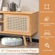Modern TV stand in natural bamboo with rattan sliding doors, featuring 6" clearance and adjustable shelf for versatile.
