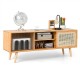 Modern TV stand in natural bamboo with rattan sliding doors and adjustable shelves for stylish, organized storage.