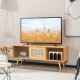 Modern TV stand in natural bamboo with rattan sliding doors, featuring adjustable shelves and cable management for.