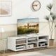 Elegant white TV stand designed for TVs up to 55 inches, featuring a spacious tabletop and stylish open cubbies for.