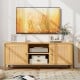 Boho TV stand with faux rattan doors, accommodating TVs up to 55 inches, featuring ample storage and elegant design.